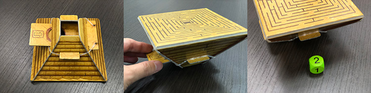 ▲ピラミッドから出たダイスの色こ数でラクダが進みます。写真は、ピラミッドでダイスを振る時の動きです。まず逆にしてスライドを引くと（中央）、ダイスがでます（右）